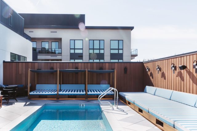 Pool area at our Denver hotel, surrounded by a wooden fence