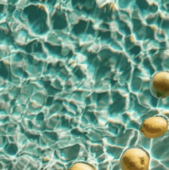 Lemons Floating on Water