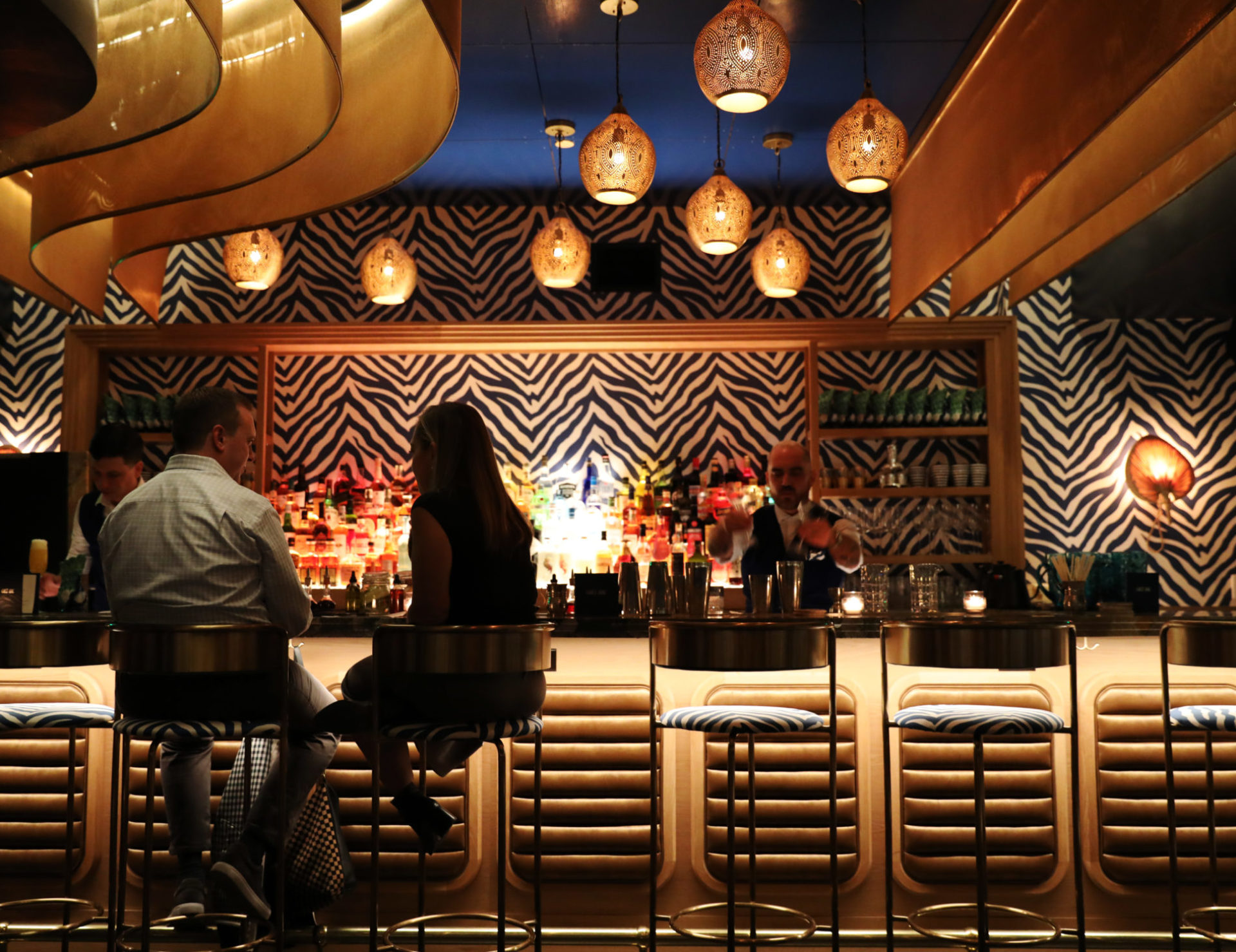 Elegant Cherry Creek hotel bar with a zebra print wall