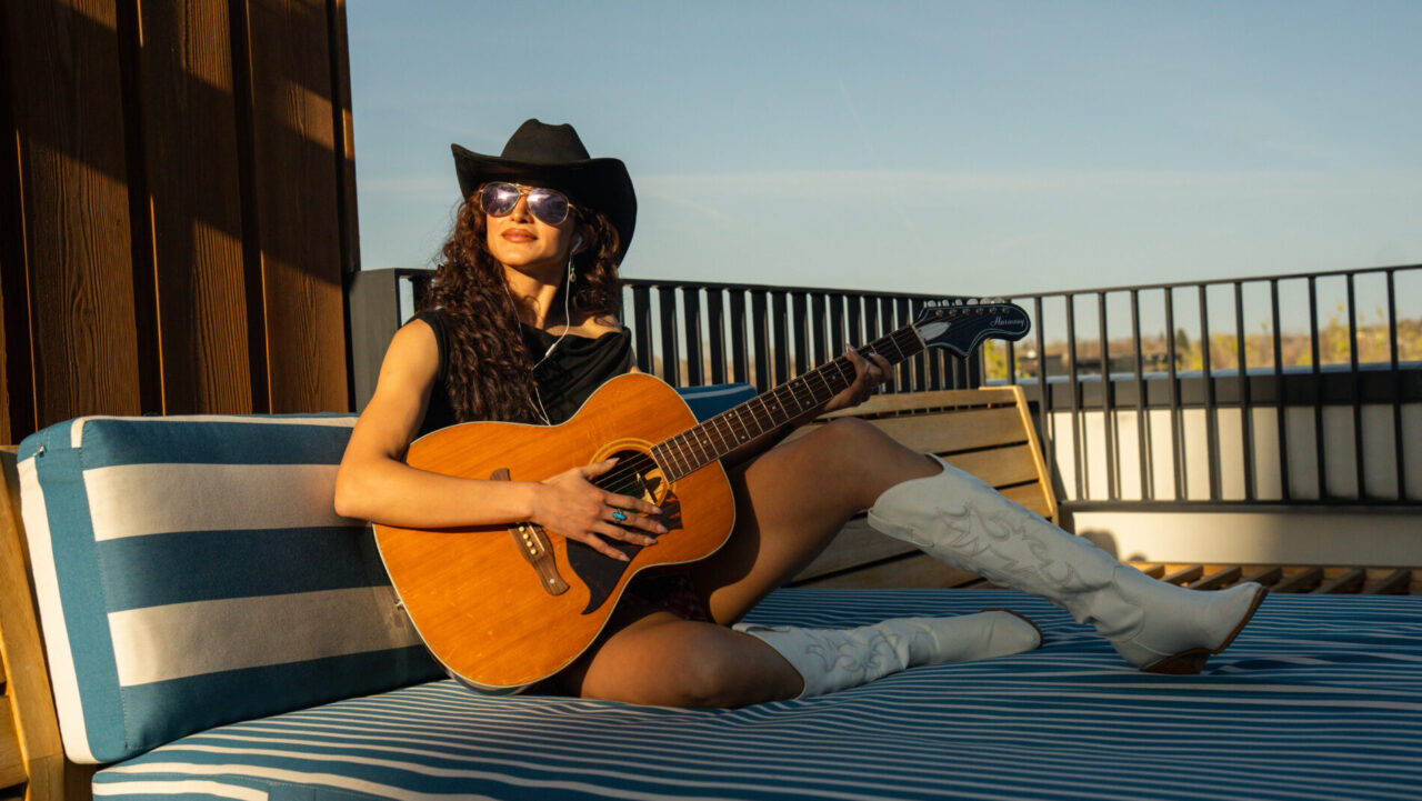 Woman playing guitar at Clayton Pool